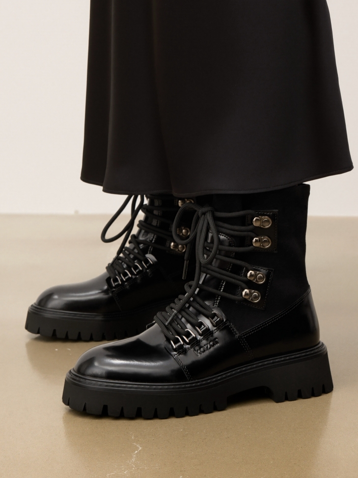 Black leather boots with fabric upper and trep sole