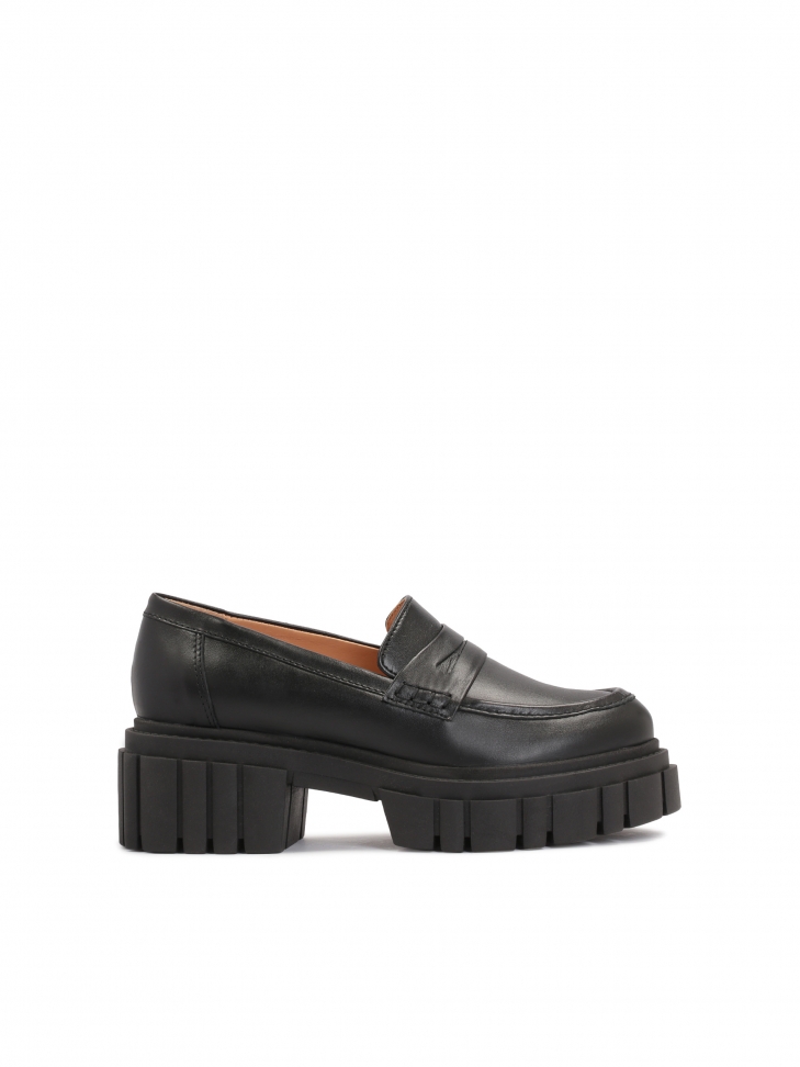 Black leather women's shoes on a thick corrugated sole