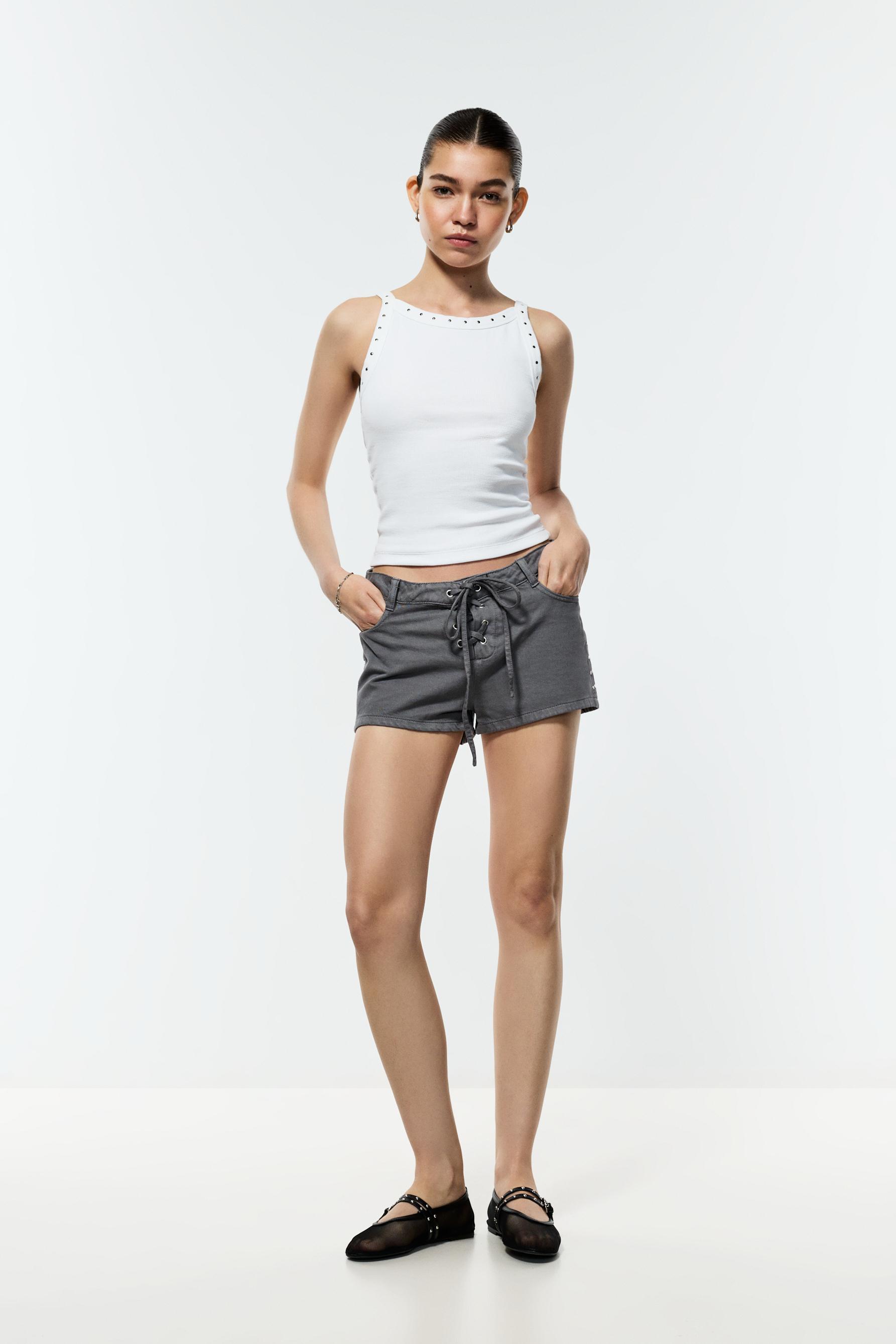 Short denim ligero lazada tachas