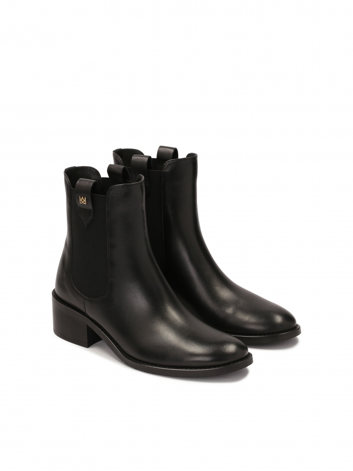 Slip-on black Chelsea boots with elastics and loops