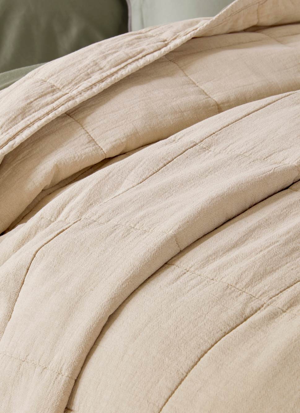 BOUT DE LIT MATELASSÉ UNI BEIGE