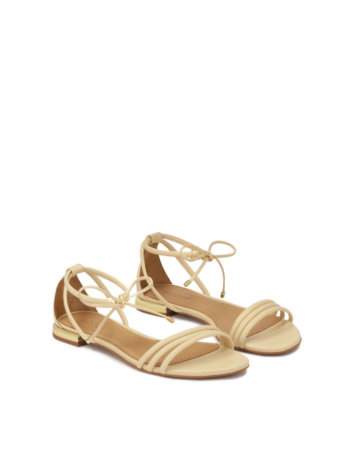 Cream sandals with binding and full heel