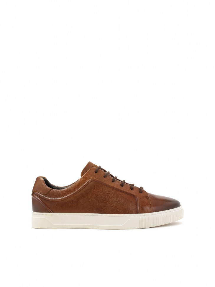 Brown sneakers on a white sole