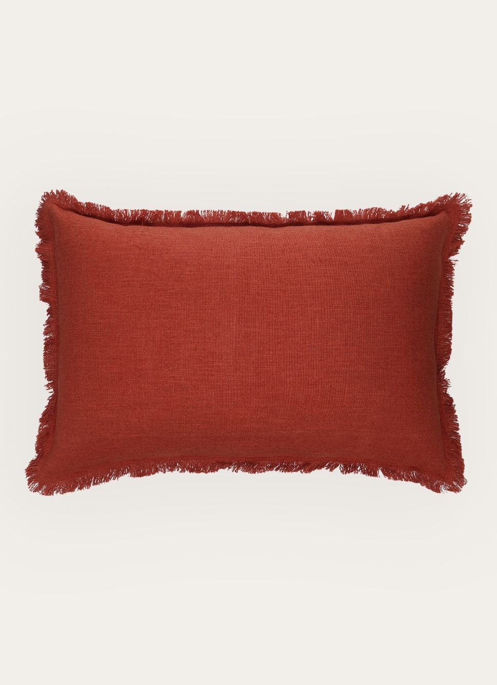 HOUSSE DE COUSSIN TEXTURÉE à MINI FRANGE BRIQUE