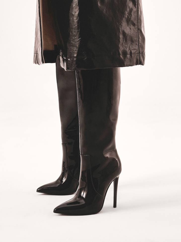 Elegant stiletto heeled boots in patent leather
