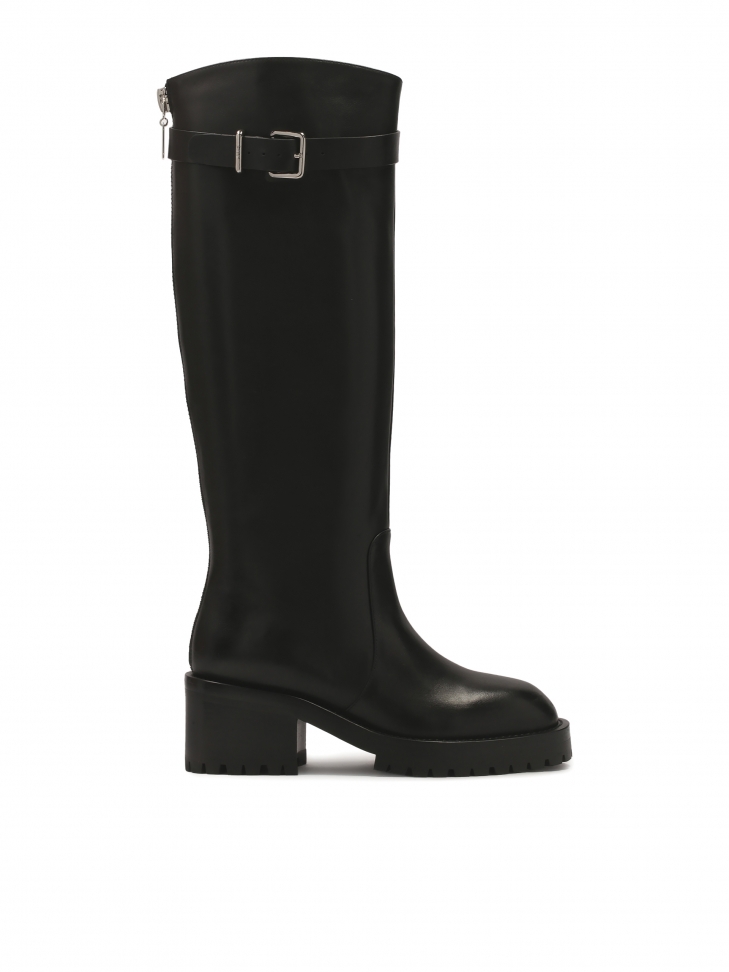 Black boots with strap and buckle around the upper