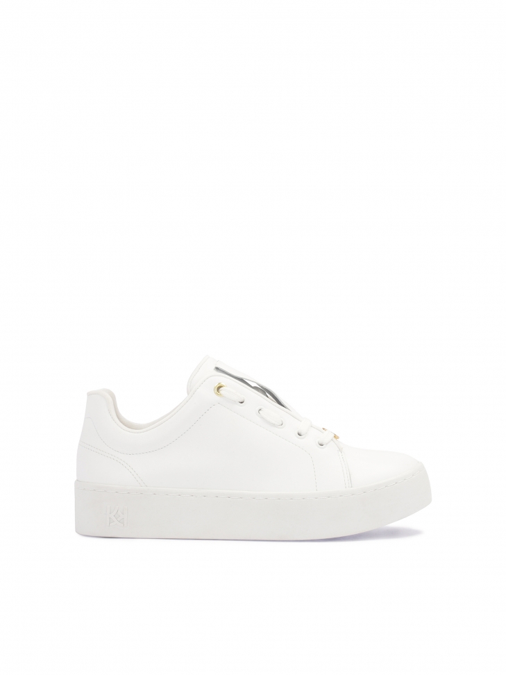 White minimalist sneakers on a simple sole