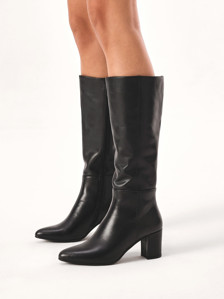 Black boots on a post