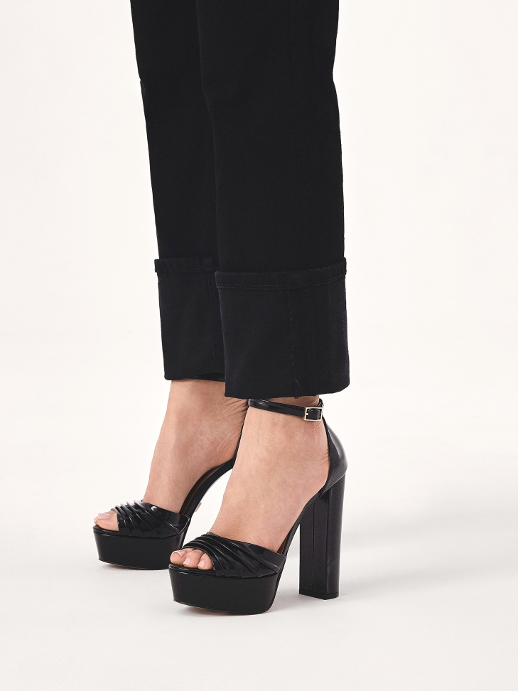 Black sandals with a wide heel and platform