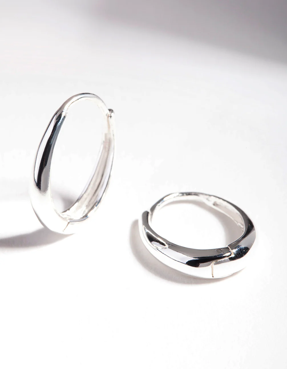 Sterling Silver Oval Drop Huggie Earrings