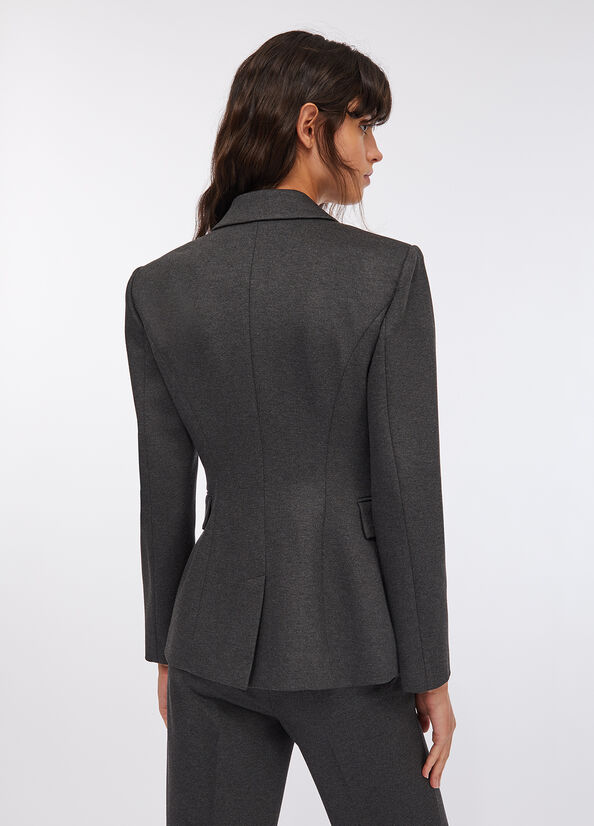 Blazer con spilla gioiello