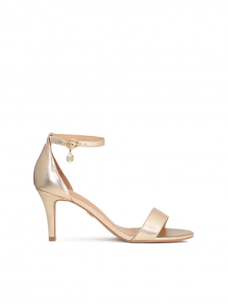 Leather golden sandals on a comfortable heel