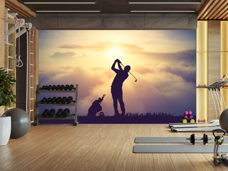 Fototapeta Golfista na tle zachodu słońca 100x70cm