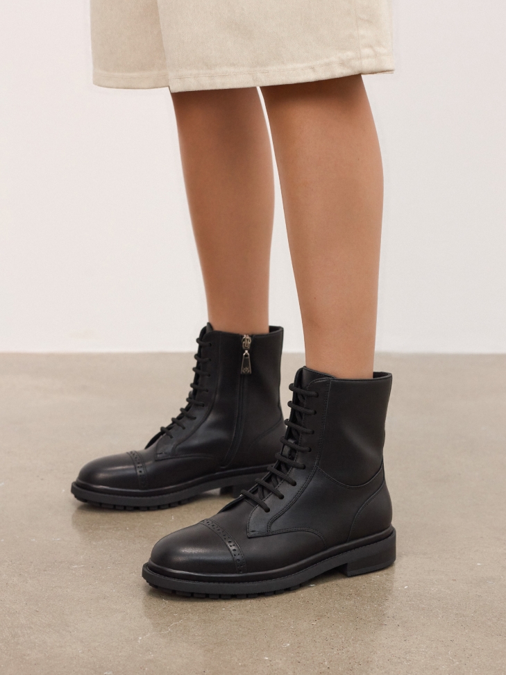 Black boots with openwork decoration