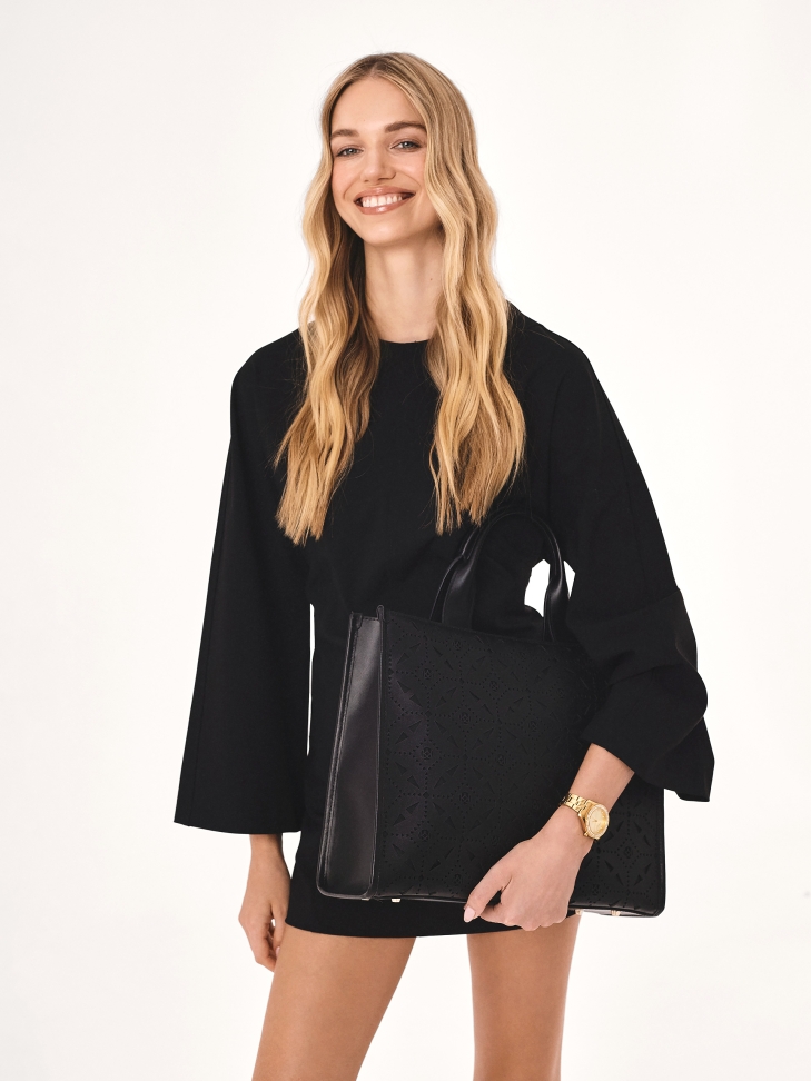 Large handbag with openwork pattern