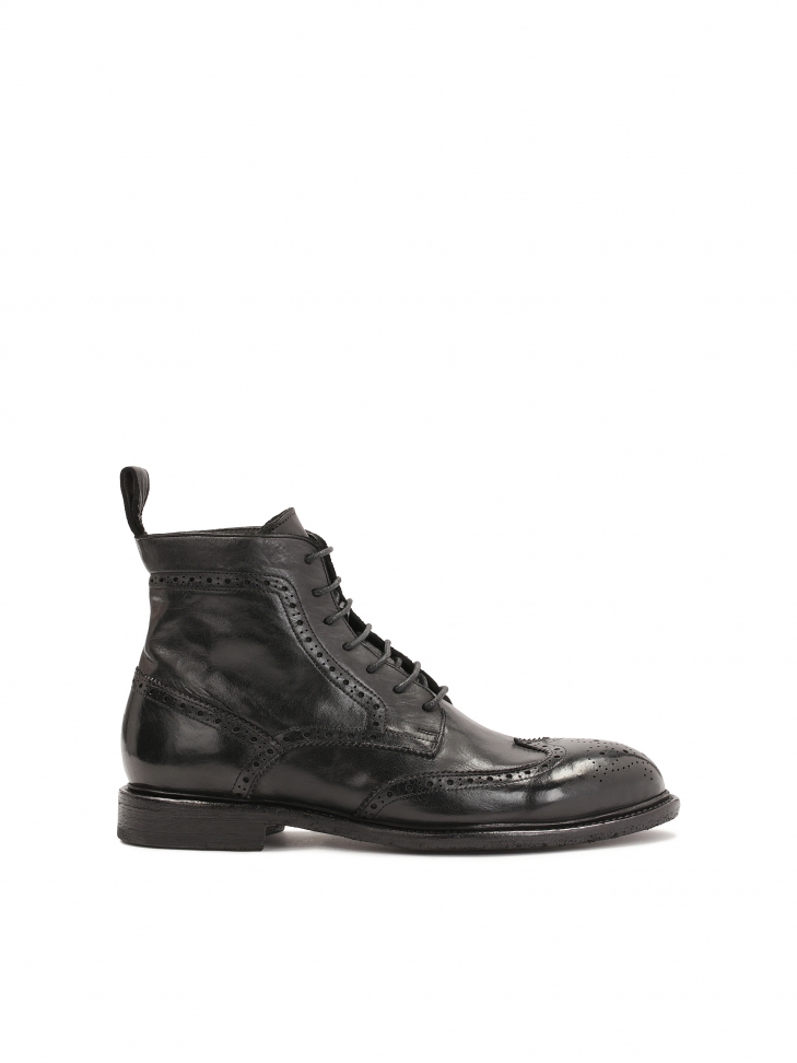 Black brogue decorated boots