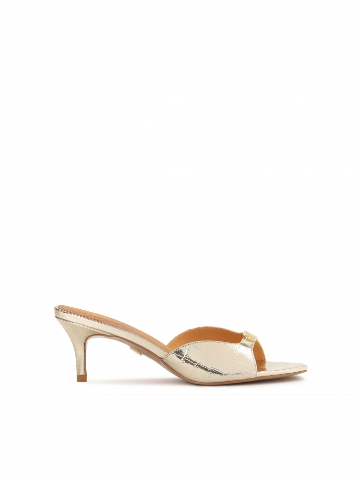 Shiny gold monogrammed mules from KAZAR