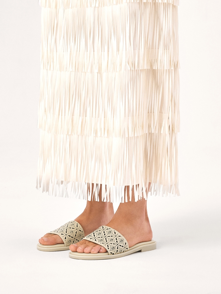 Cream slides with a wide strap in a fine pattern