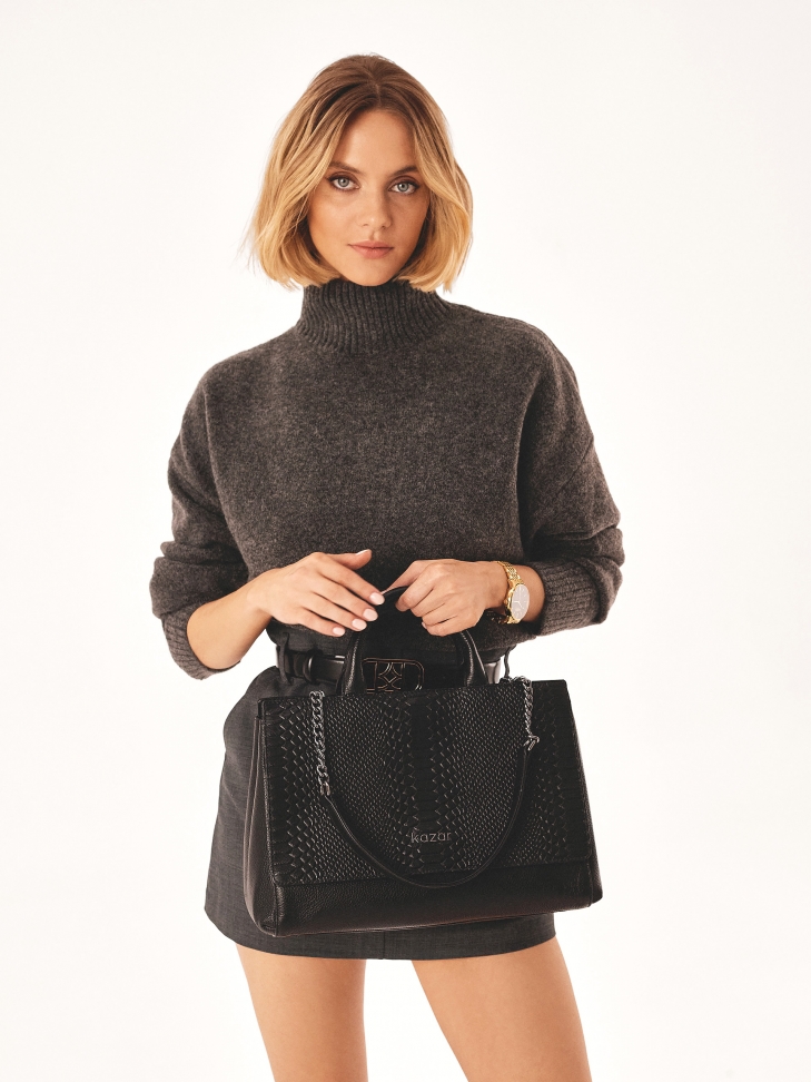 Black handbag with an unusual shape