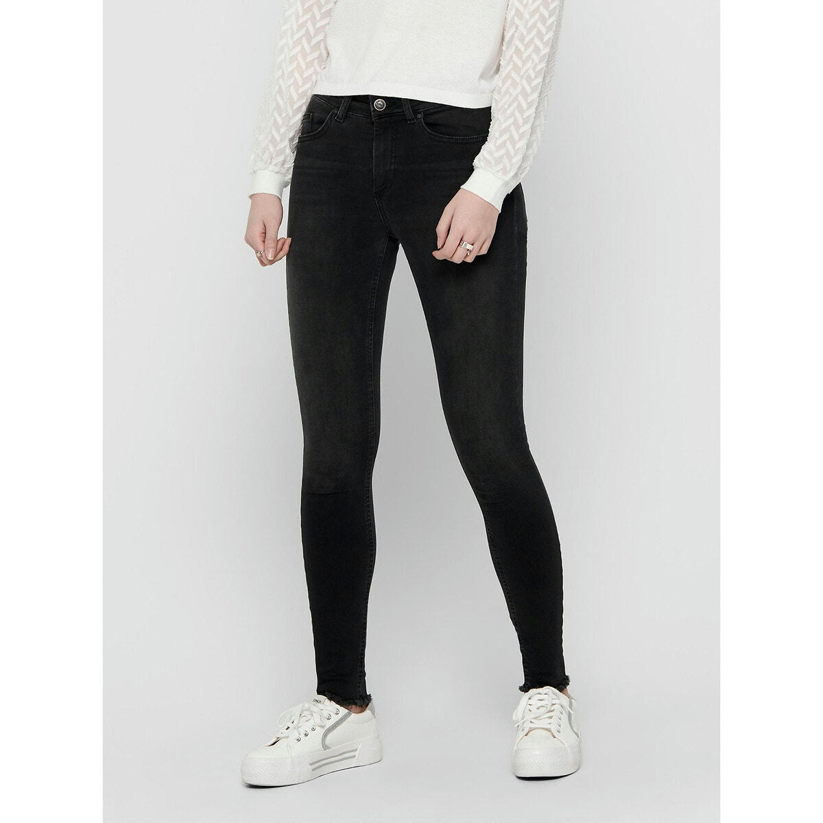Jean skinny, bas frangé