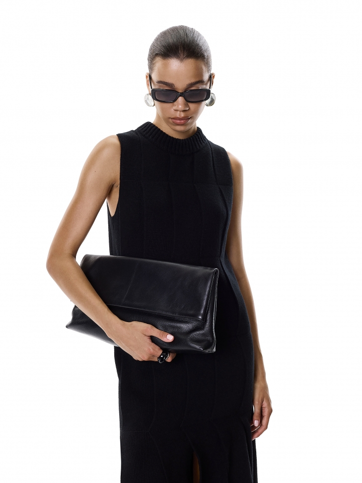 Elongated clutch bag for hand in black color