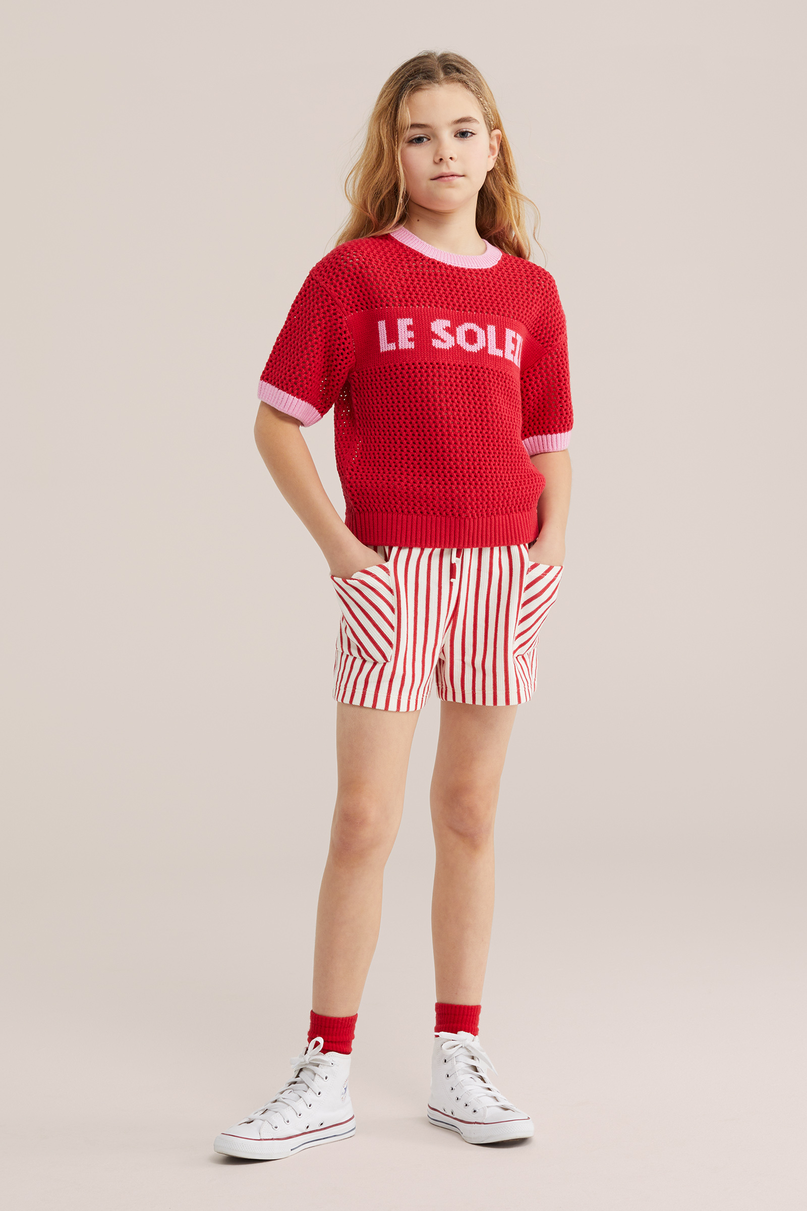 Meisjes gebreide trui met opengewerkte structuur