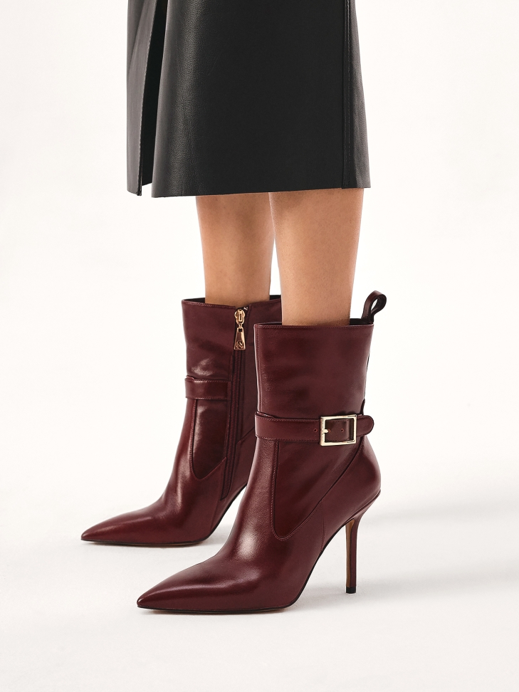 Maroon boots with pointed toes