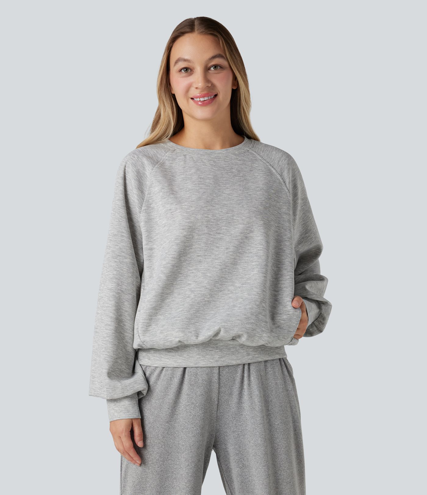 Sweat-shirt col rond manches longues à découpes avec poches