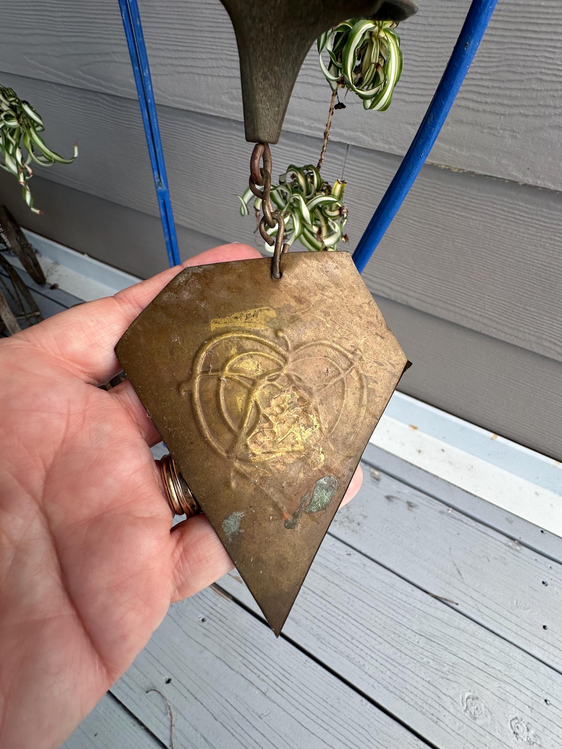 A vintage Harmony Hollow Bell Works (HHBW) patinated bronze bell Wind Chime