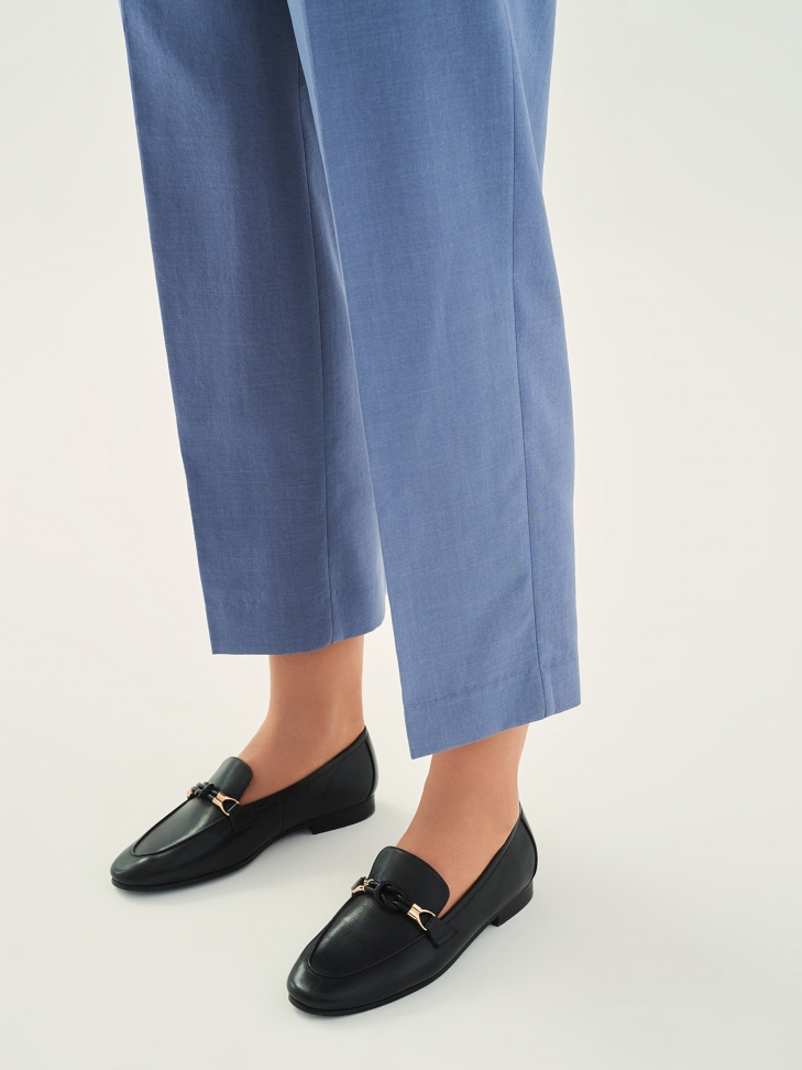 Black leather flat shoes on a flat heel