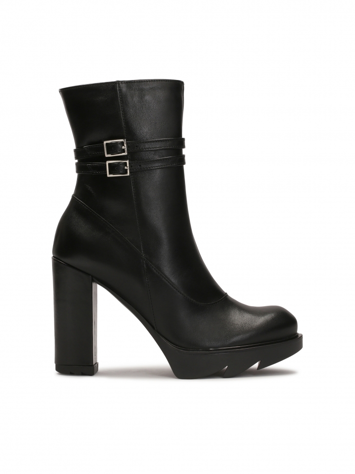 Black boots on a post