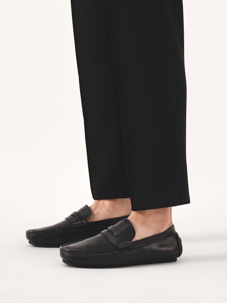 Slip-on black moccasins with heel overlay