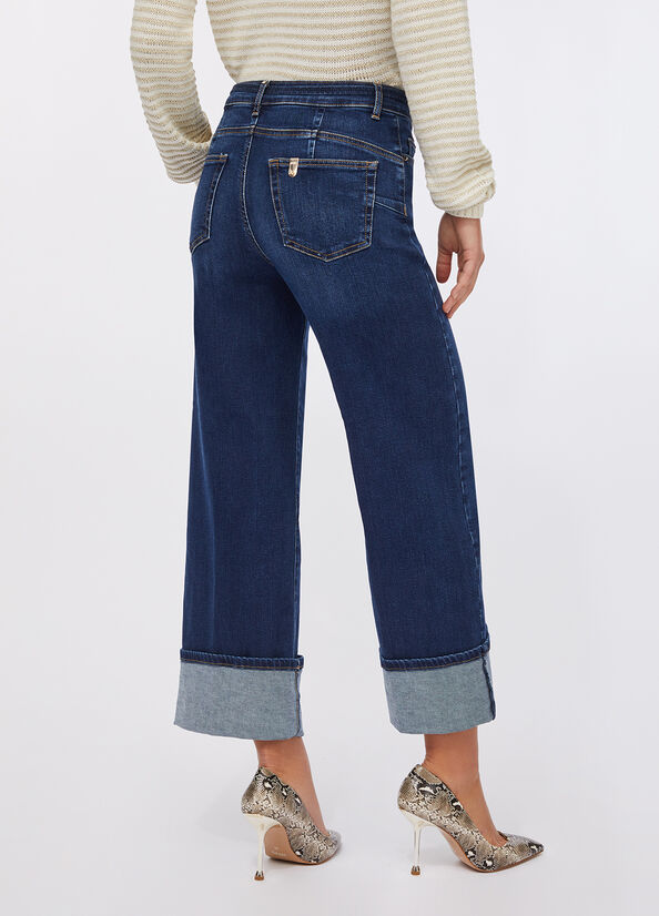 Jeans flare cropped con cintura