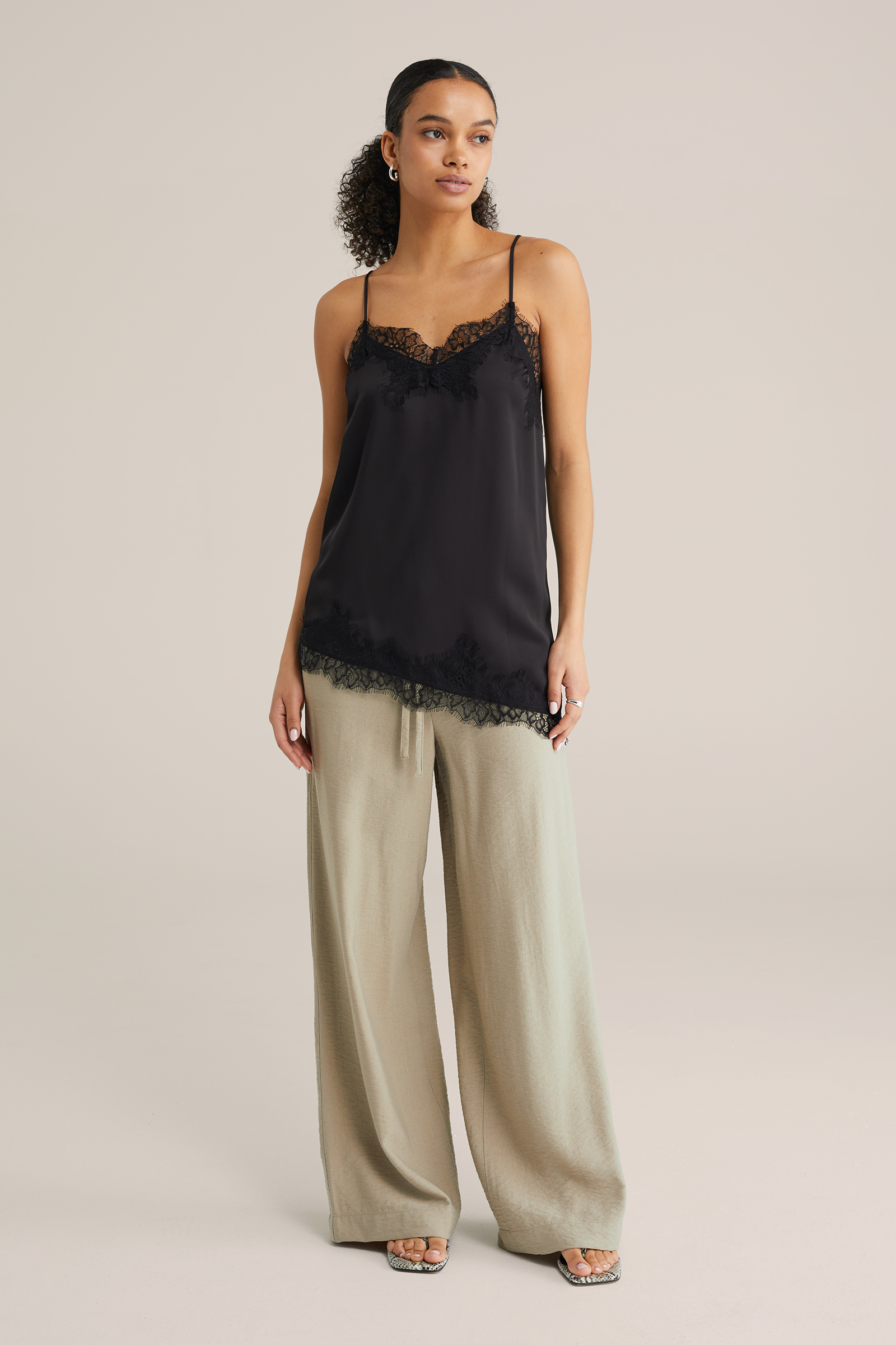 Dames asymmetrisch singlet met kant