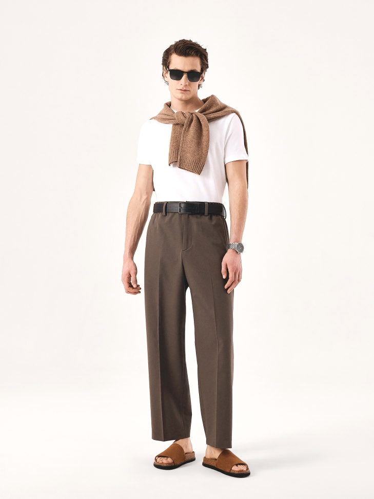 Brown suede slides on a cork sole