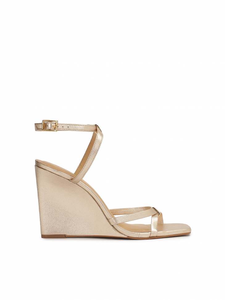 Gold sandals on a platform