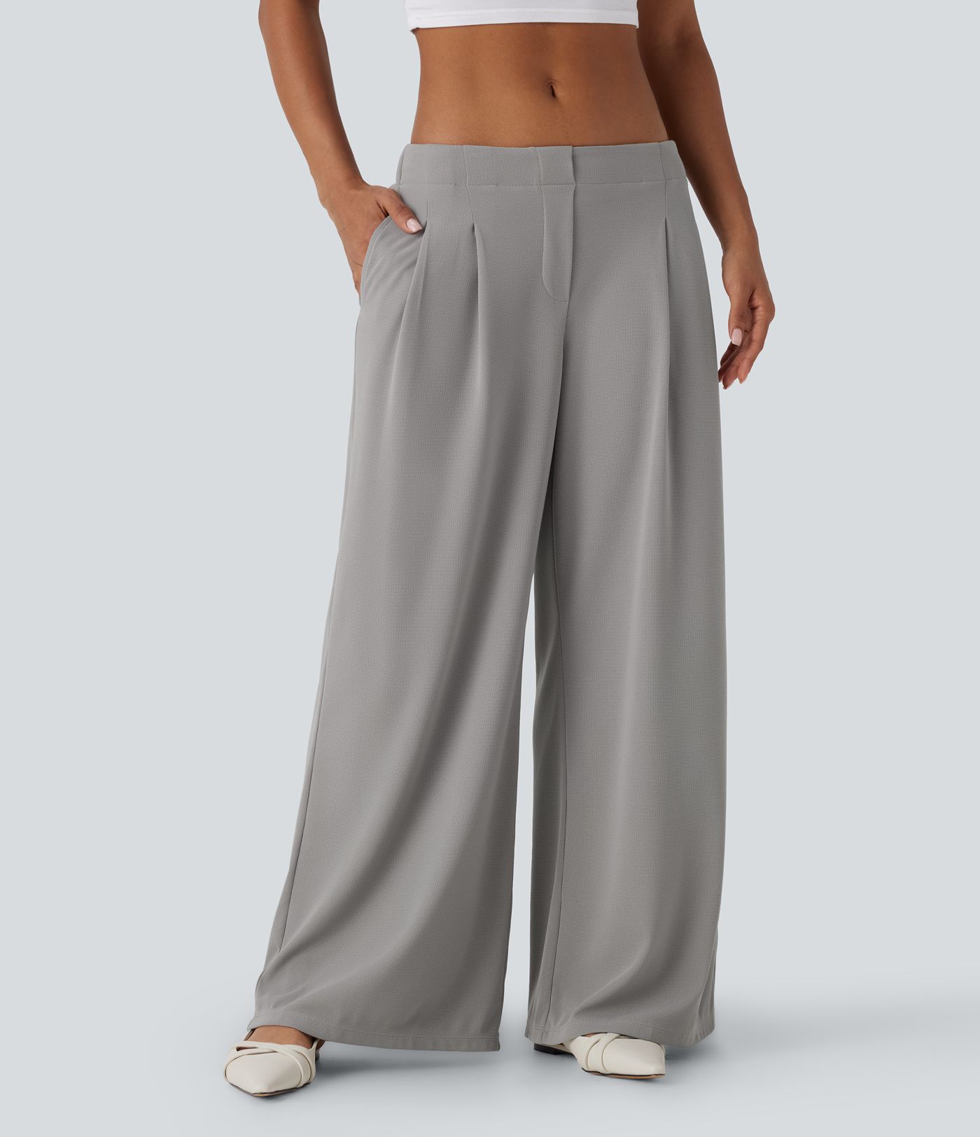Pantalon décontracté taille basse à jambes larges en tissu gaufré avec poches latérales