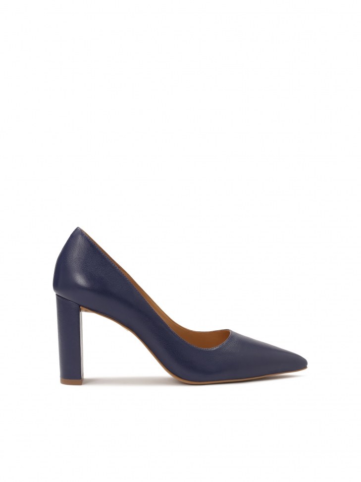Navy blue pumps on a post with pointed toe noses