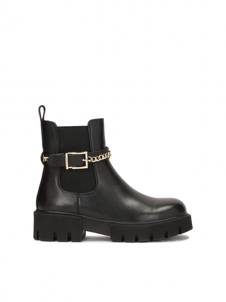 Chelsea boots with decorative belt and chain