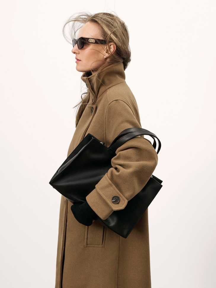 Black classic handbag with two handles