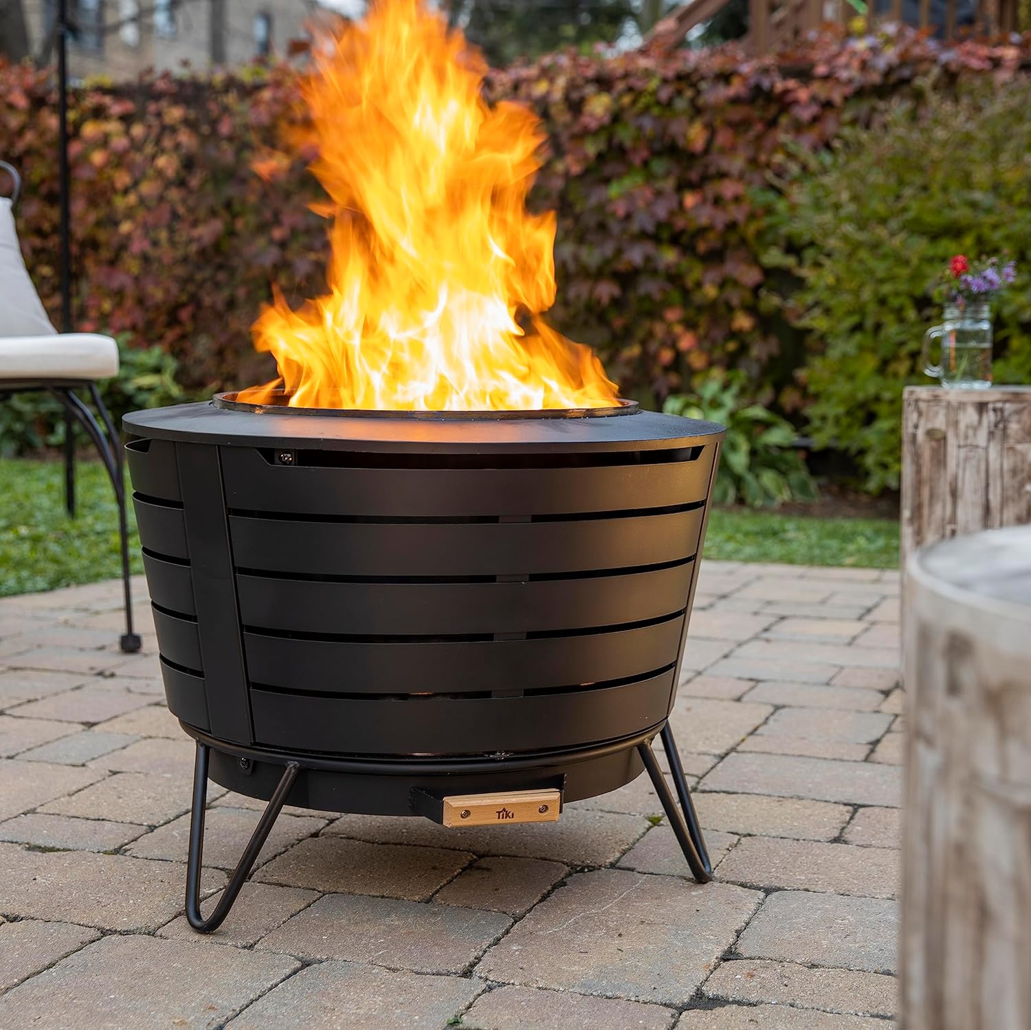 TIKI Patio Smokeless Outdoor Fire Pit  25-Inch Wood-Burning Bonfire with Removable Ash Pan  Stand  and Weather-Resistant Cover