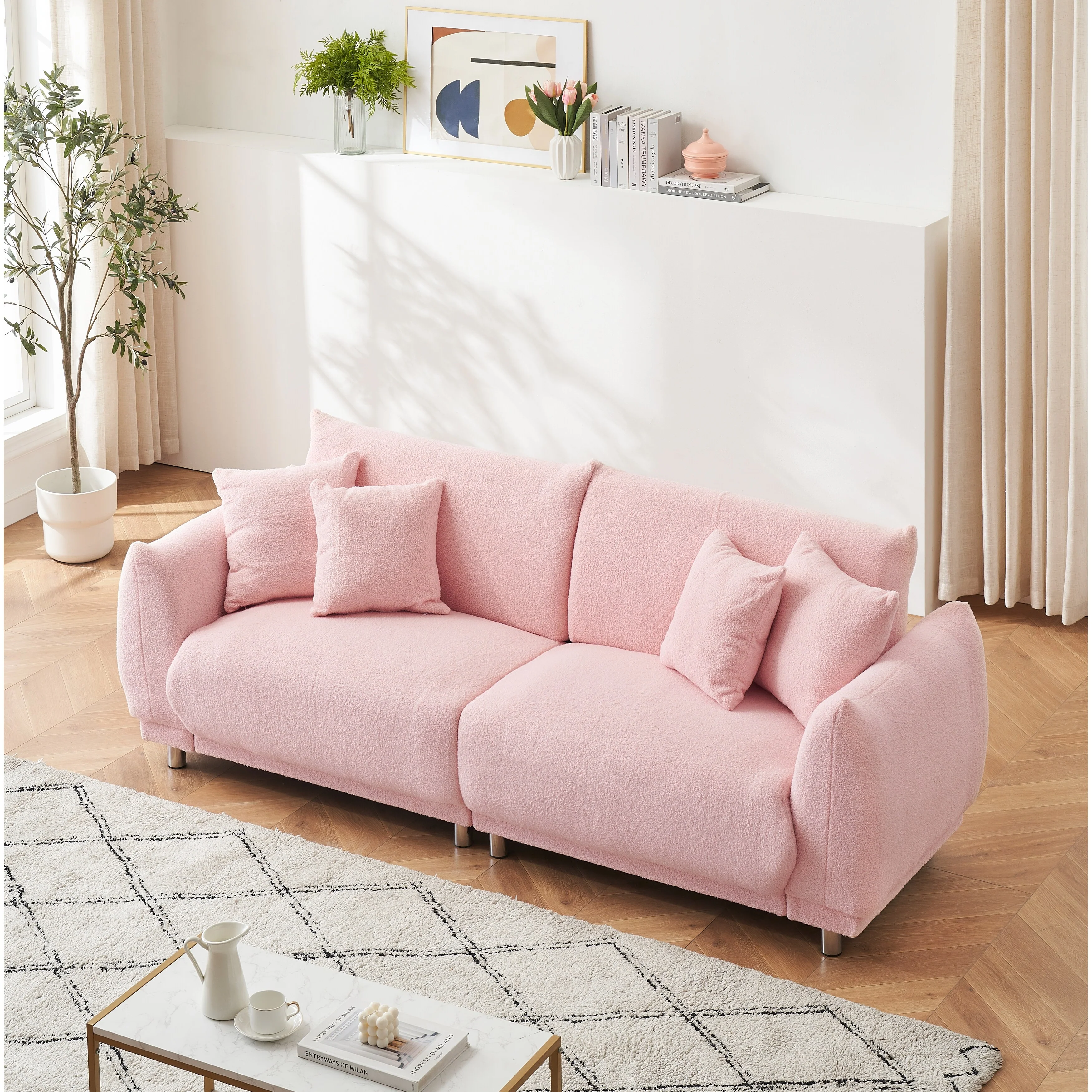 86.6 inch teddy fleece pink sofa with four throw pillows and hardware feet can sit comfortably in an apartment bedroom