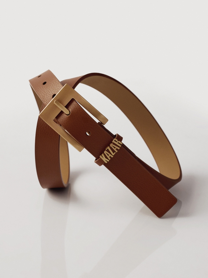 Light brown belt with metal logo