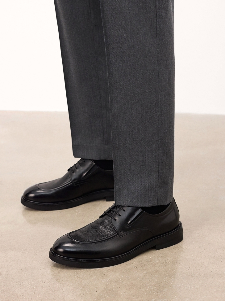 Black shoes with decorative stitching