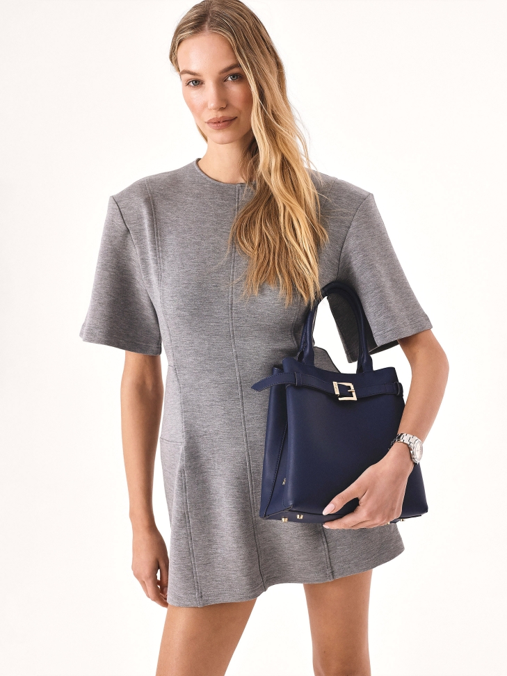 Navy blue handbag with hand grips and strap