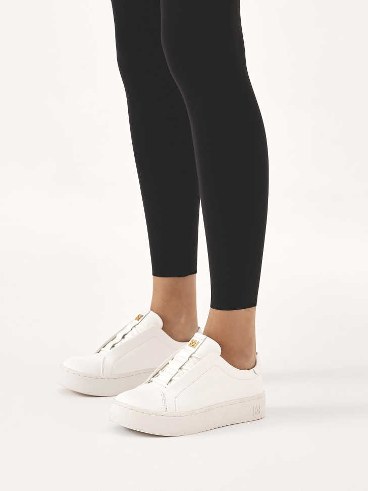 White sneakers with covered lace handles