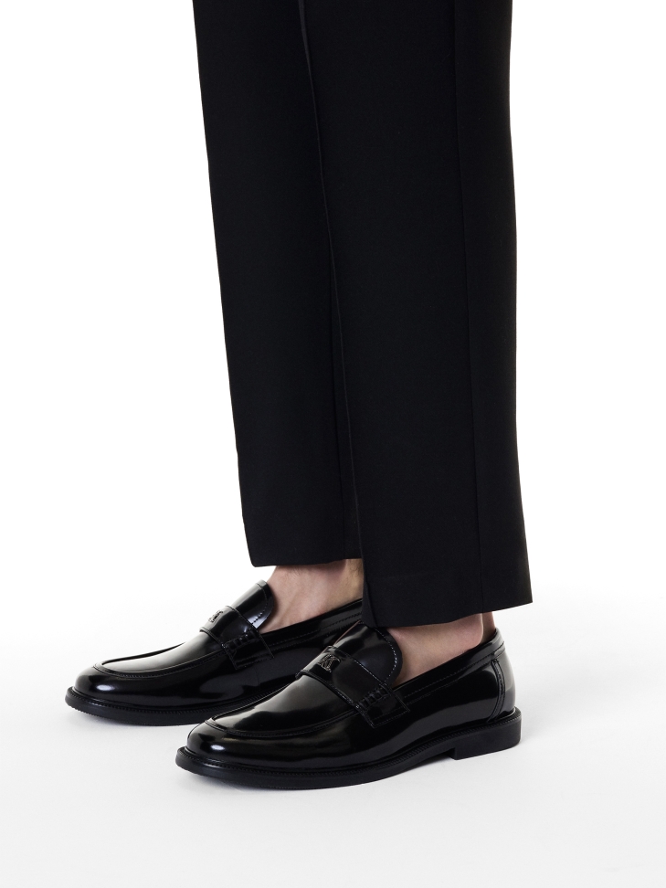 Monogrammed black slip-on loafers