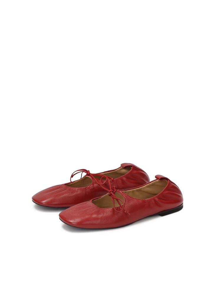 Tiered red ballerinas on a leather sole