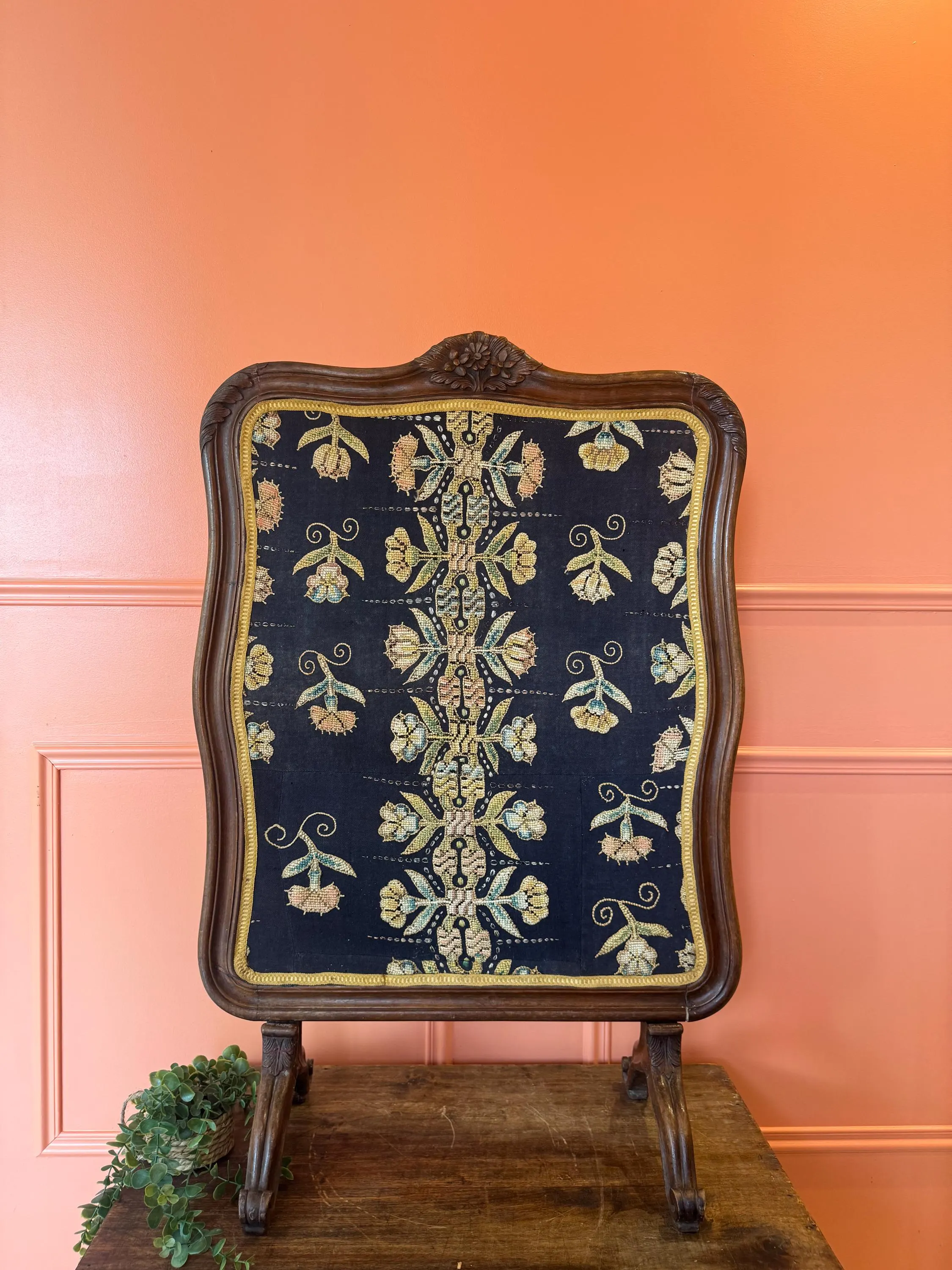 Antique wooden and fabric fireplace screen