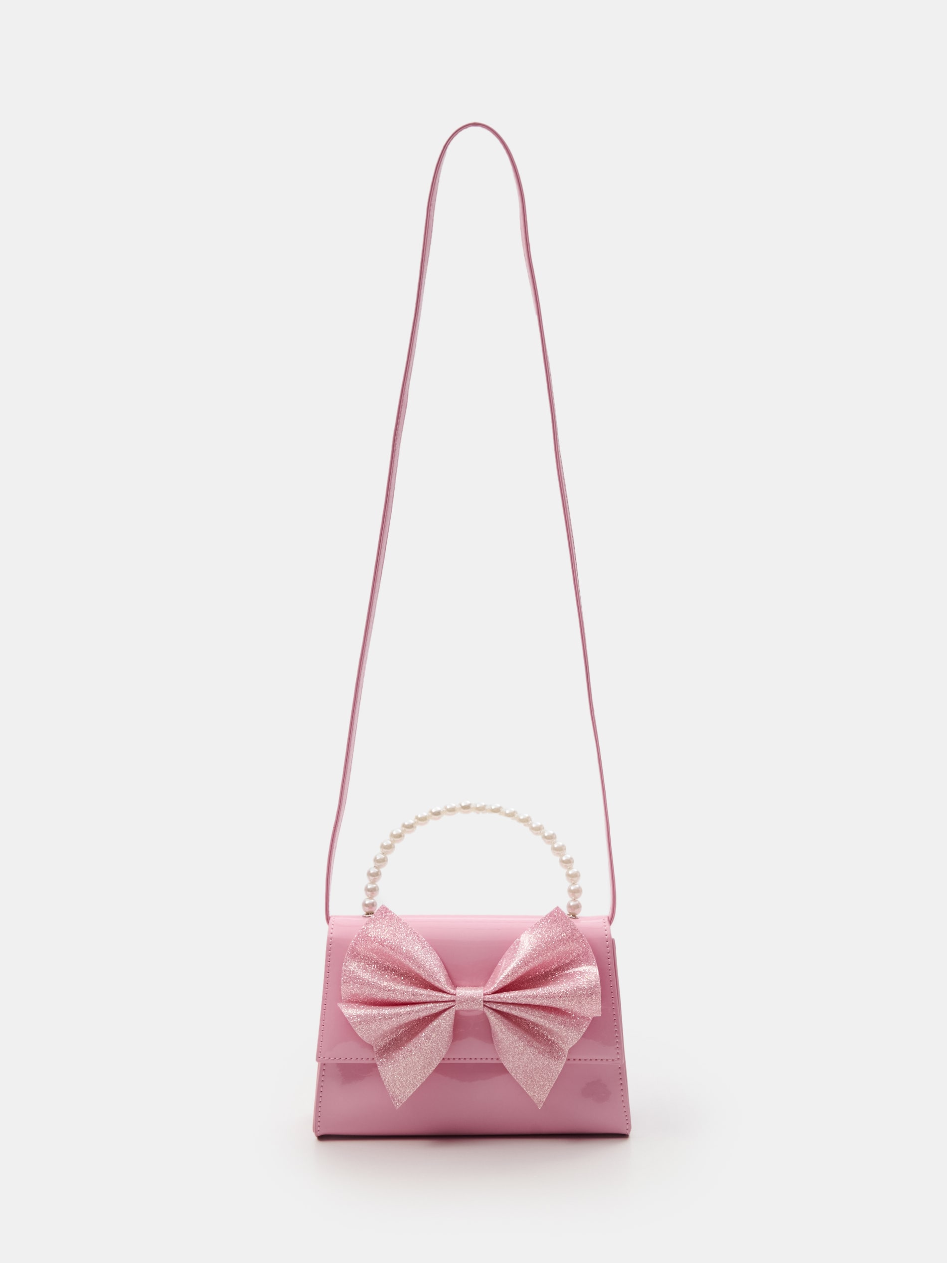 Torebka crossbody z kokardą i perełkową rączką